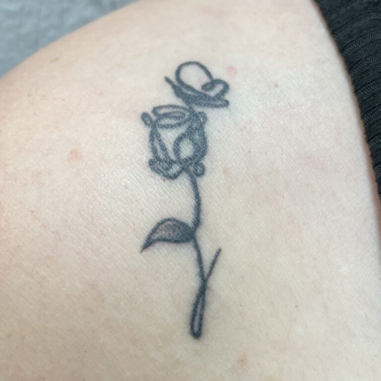 Example of Teenzy Tat, a line art flower leading into a flower
